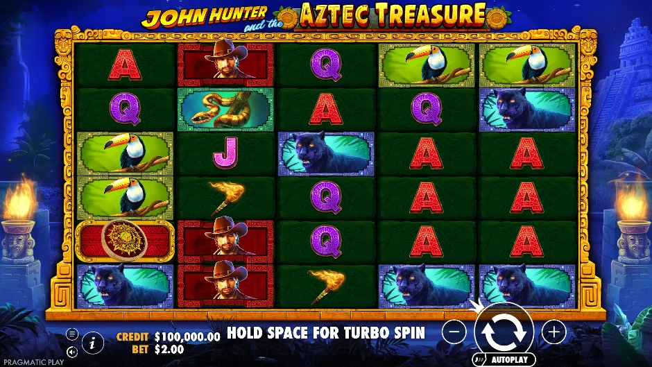 Pantalla de la tragamonedas John Hunter and the Aztec Treasure con una búsqueda entre templos y reliquias aztecas