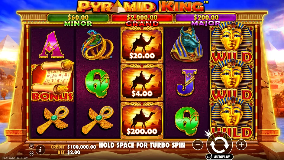 Pantalla de Pyramid King con un faraón vigilando una pirámide dorada